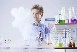 Young Researcher Stampe: Curious pupil posing with test tubes and flasks