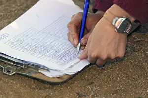 Nature Reserve Exploration Stampe: Data sheet being filled in with scientific data