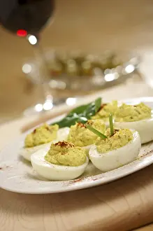 Empty Table Setting Photos Stampe: Deviled eggs and appetizers on a decorative white plate