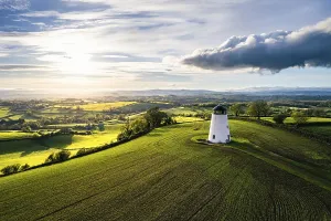 Devon Windmill Aerial View Stampe: Devon windmill from a drone, fields and farms