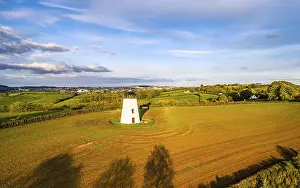 Devon Windmill Aerial View Stampe: Devon windmill from a drone, fields and farms