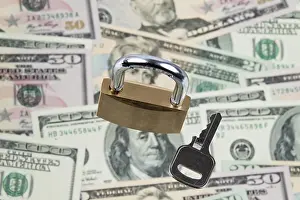US Dollar Notes Stampe: Many dollar banknotes with a lock