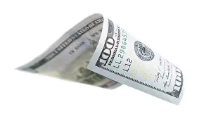 One Hundred Dollar Bill Stampe: One hundred dollar bill falling or floating on empty background