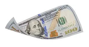 US Dollar Note Stampe: One hundred dollar bill falling or floating on empty background