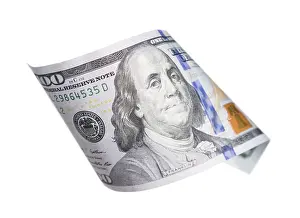 One Hundred Dollar Bill Stampe: One hundred dollar bill falling or floating on empty background