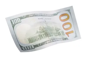 US Dollar Note Stampe: One hundred dollar bill falling or floating on empty background