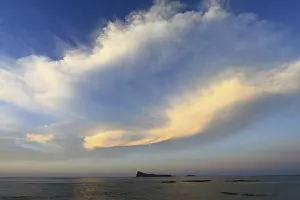 Cloudy Evening Mood Stampe: Dramatic clouds on the coast over island