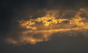 Dramatic Clouds At Sunset Stampe: Dramatic clouds at sunset, black clouds
