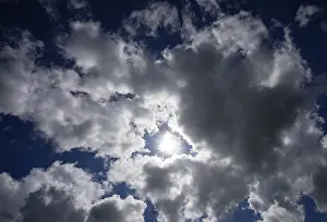 Cloudy Atmosphere Stampe: Dramatic cloudscape with (cumulus) clouds and sunrays