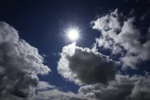 Thunderstorm Atmosphere Stampe: Dramatic cloudscape with (cumulus) clouds and sunrays