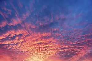 German Evening Sky Stampe: Dramatic evening sky with red clouds after sunset