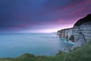Deserted Rocky Coastline Europe Stampe: Dramatic fire sunrise over cliffs in ocean