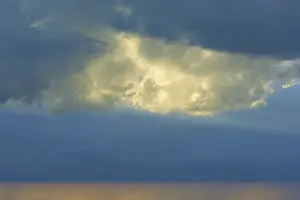 Western Europe Landscape Stampe: Dramatic sky with bright clouds in the sunlight shining through a gap