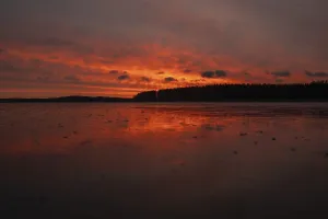 Frozen Lake Landscape Photography Stampe: A dramatic sunset over a still