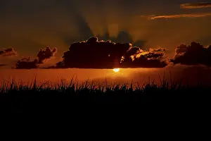 Mauritius Sunset Stampe: Dramatic sunset behind clouds, Chebel