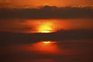 Central Europe Cloudy Skies Stampe: Dramatic sunset behind clouds, Schleswig-Holstein