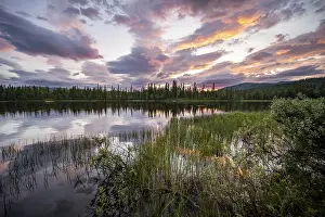 Scandinavian Evening Atmosphere Stampe: Dramatic sunset by the river Namsen with reflection