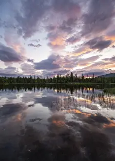Northern Europe Evening Light Stampe: Dramatic sunset by the river Namsen with reflection
