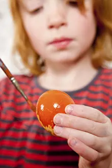 Easter Egg Painting Stampe: Easter, child painting an easter egg