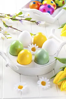 Christian Easter Traditions Stampe: Easter eggs with spring flowers decorating table