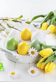 Christian Easter Traditions Stampe: Easter eggs with spring flowers decorating table