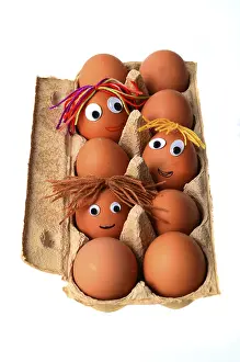 Funny Food Photography Stampe: Eggs with faces in an egg box