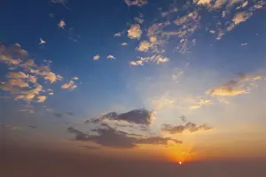 Atmospheric Evening Mood Stampe: Evening sunset sky with sun and dramatic clouds