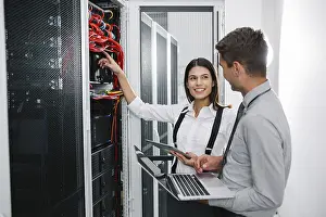Blockchain Technology Stampe: IT expert checking supercomputer server