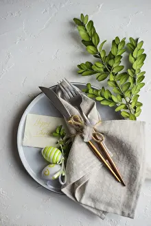 Plain White Background Photo Stampe: Festive table setting for Easter dinner on white background with copy space