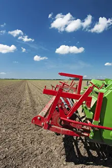Dutch Windmill Landscape Stampe: Fields with young vegetable fields and detail of planting machine