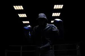 Young Sportsman Stampe: Fighter without a face is standing with his hands up