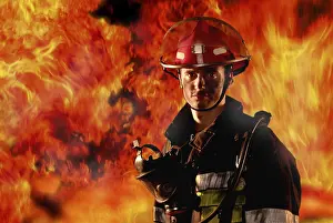 Protective Clothing For Firefighters Stampe: Firefighter in front of a wall of fire