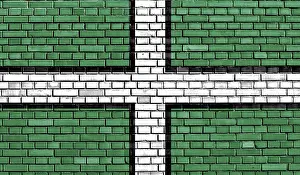 British Nationality Symbol Stampe: Flag of Devon painted on brick wall