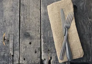 Rustic Wooden Table Stampe: Flatware on a rustic wooden table with space for text