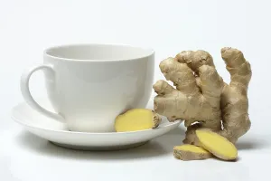 Ginger Health Benefits Stampe: Ginger root with cup, ginger tea