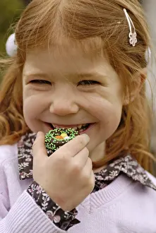 Easter Sweets Stampe: Girl eats sweets at easter time