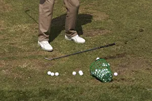 Recreational Golf Activity Stampe: Golfer practicing his swing at the range