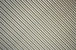 South American Architecture Stampe: A gray security shutter over the front of a building in Cotacachi