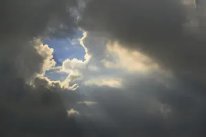 Northern Europe Weather Stampe: Gray sky with clouds and sun rays