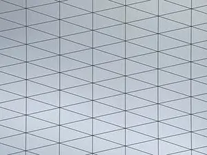Minimalist Architectural Style Stampe: A gray surface featuring a modern geometric pattern composed of interconnected triangles