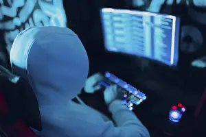 Computer Hacking Stampe: Hacker using computer malware virus software and hacking binary code green digital interface