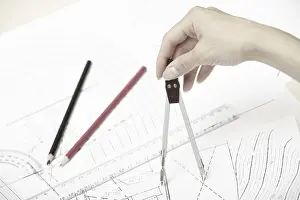 Construction Plan Stampe: Hand of engineer working on a construction plan