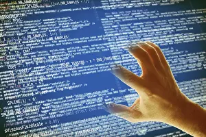 Data Security Threats Stampe: Hand grabbing a computer code, hacking and computer crime concept