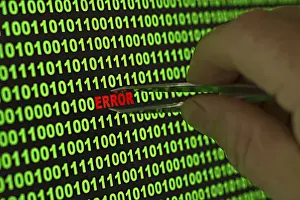 Binary Code Error Stampe: Hand reaching for the word 'Error' with tweezers in a binary code Hand reaching for the word