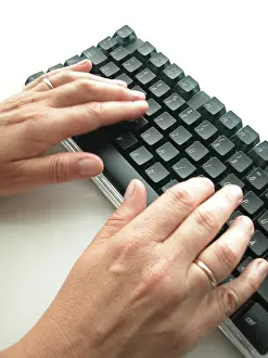 Electronic Communication Tools Stampe: Hands at computer keyboard