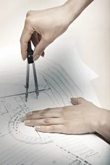 Construction Project Planning Stampe: Hands of engineer working on a construction plan