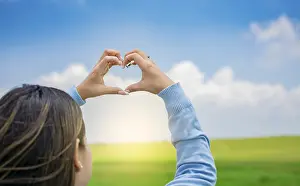 Close Up Heart Shape Stampe: Hands together in a heart shape