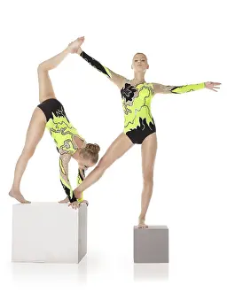 Circus Artist Training Stampe: Two high skill acrobats exercise program on cube isolated