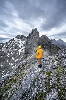 Wetterstein Mountains Stampe: Hiker looking at mountains under dramatic clouds