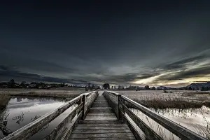 Bavarian Winter Landscape Stampe: Holzsteg over the Ach with reflection and dramatic sky